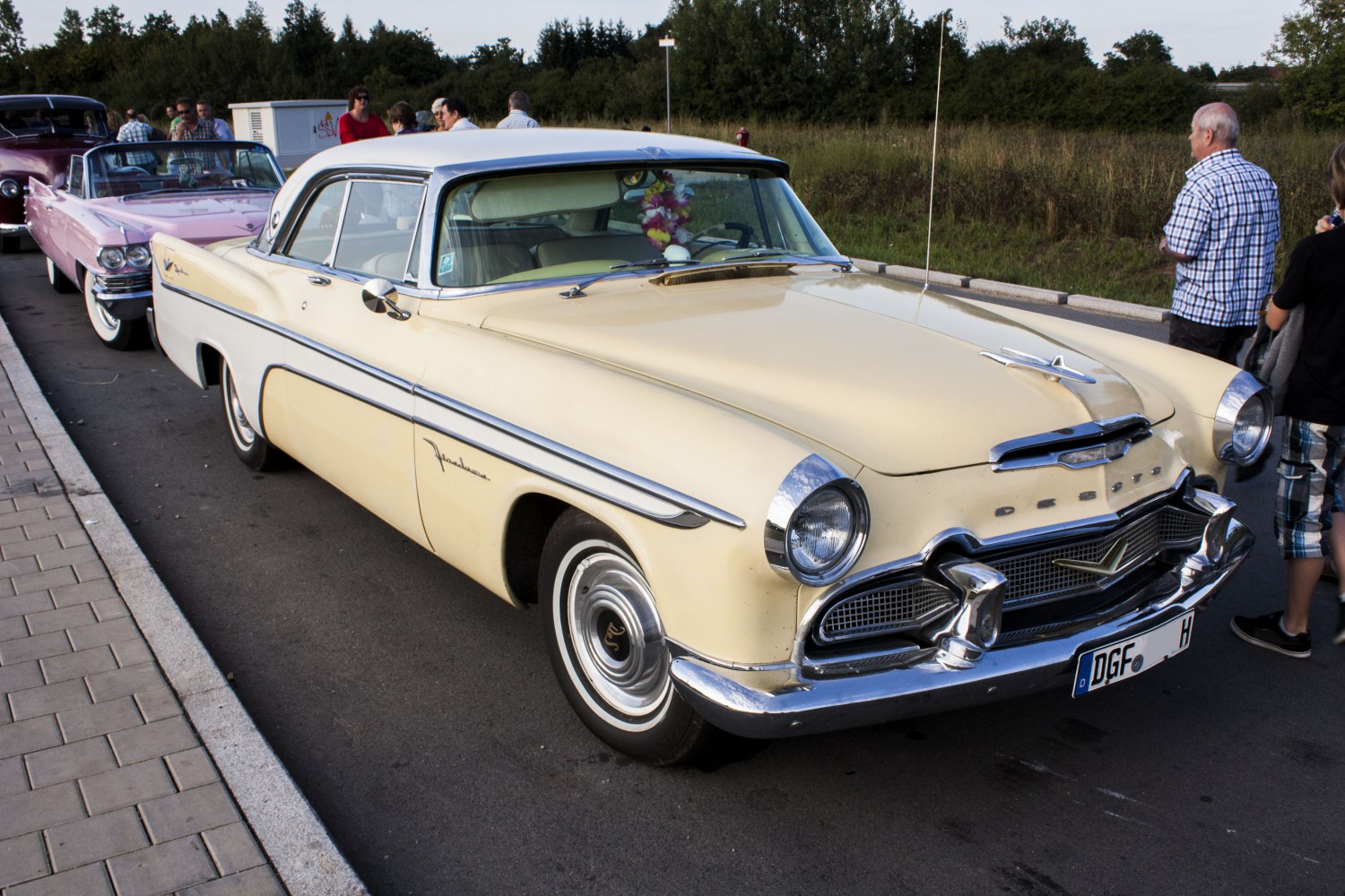 Classic 1950s two-door coupe with chrome details and a distinctive front grille
