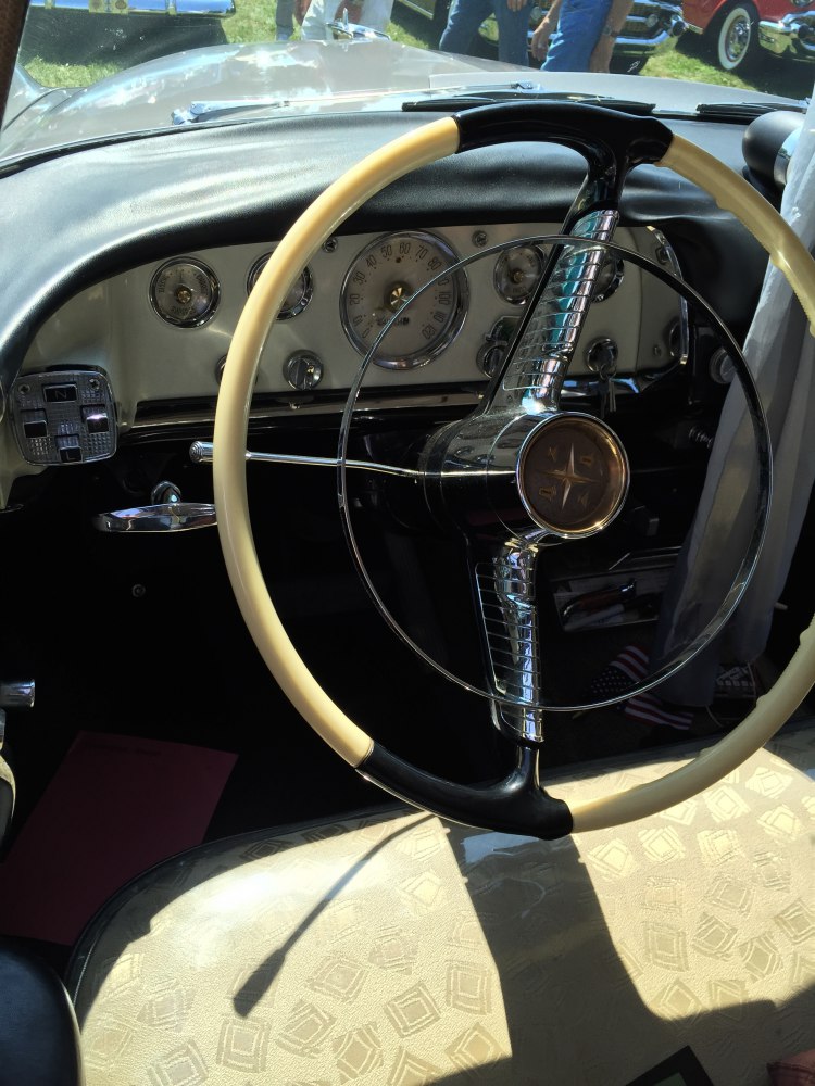 Vintage two-tone steering wheel and retro dashboard gauges