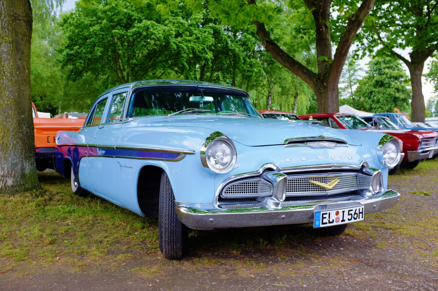 Classic 1950s four-door sedan with chrome grille and vintage styling