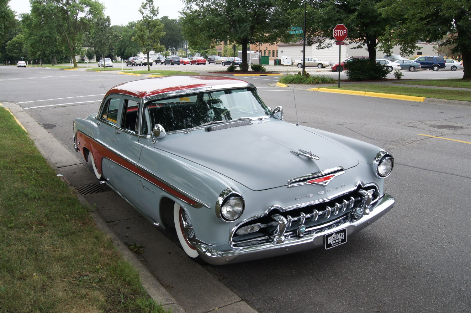Classic 1950s sedan with chrome grille and two-tone paint.