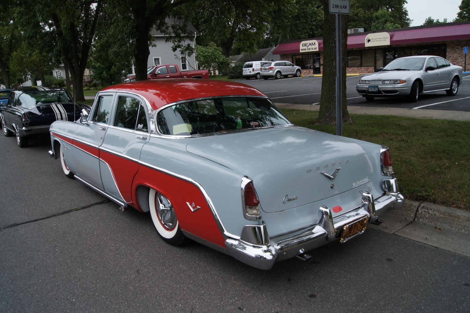 Four-door sedan with two-tone paint and whitewall tires