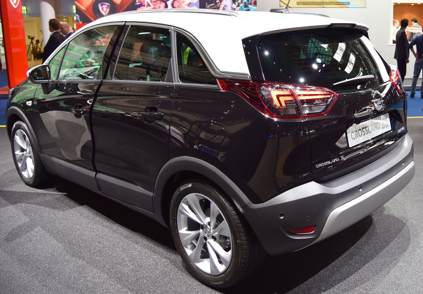 Rear-side view of a compact SUV with two-tone roof and LED taillights