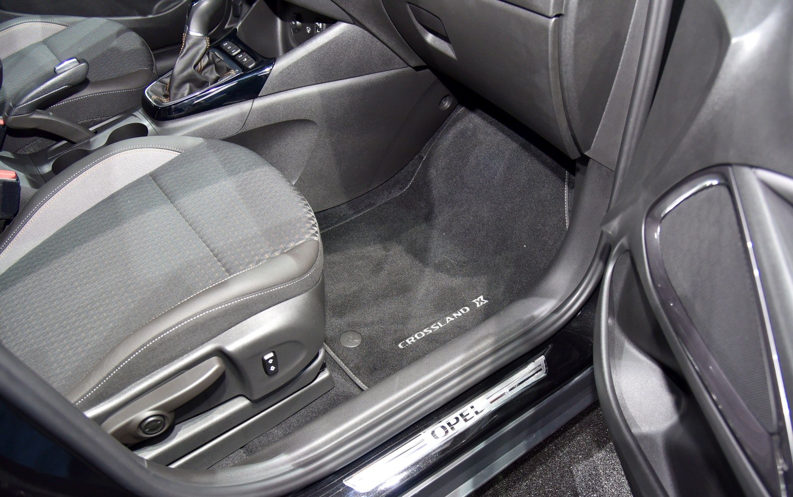 Interior front passenger seat and floor mat with door sill