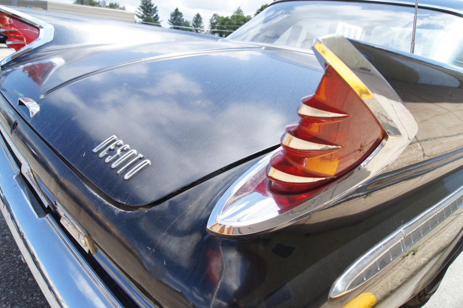 Tail fin and badge on classic 1960 sedan