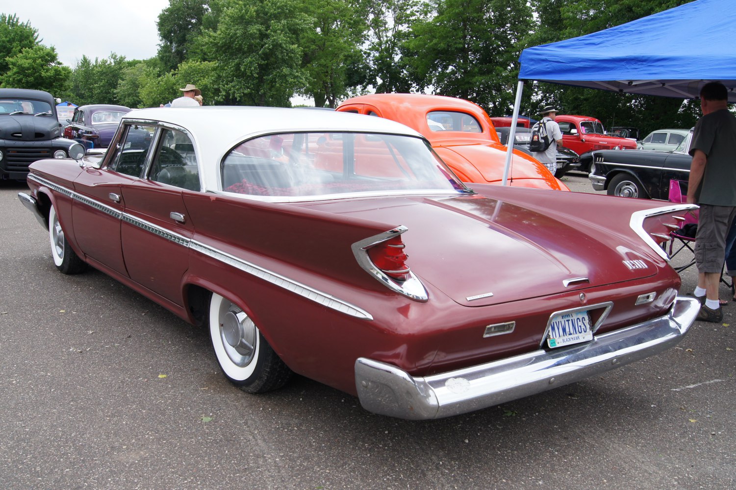 Classic rear tailfin and chrome trim on a vintage four-door sedan