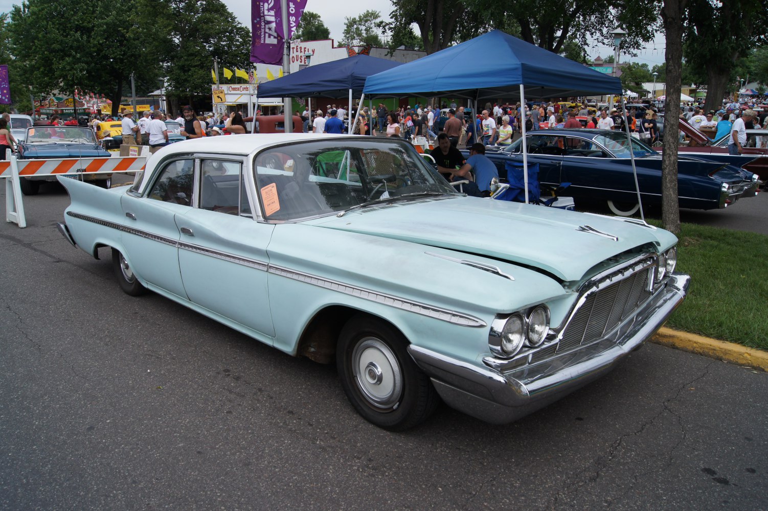 Classic sedan with iconic 1960 tail fins and dual headlights