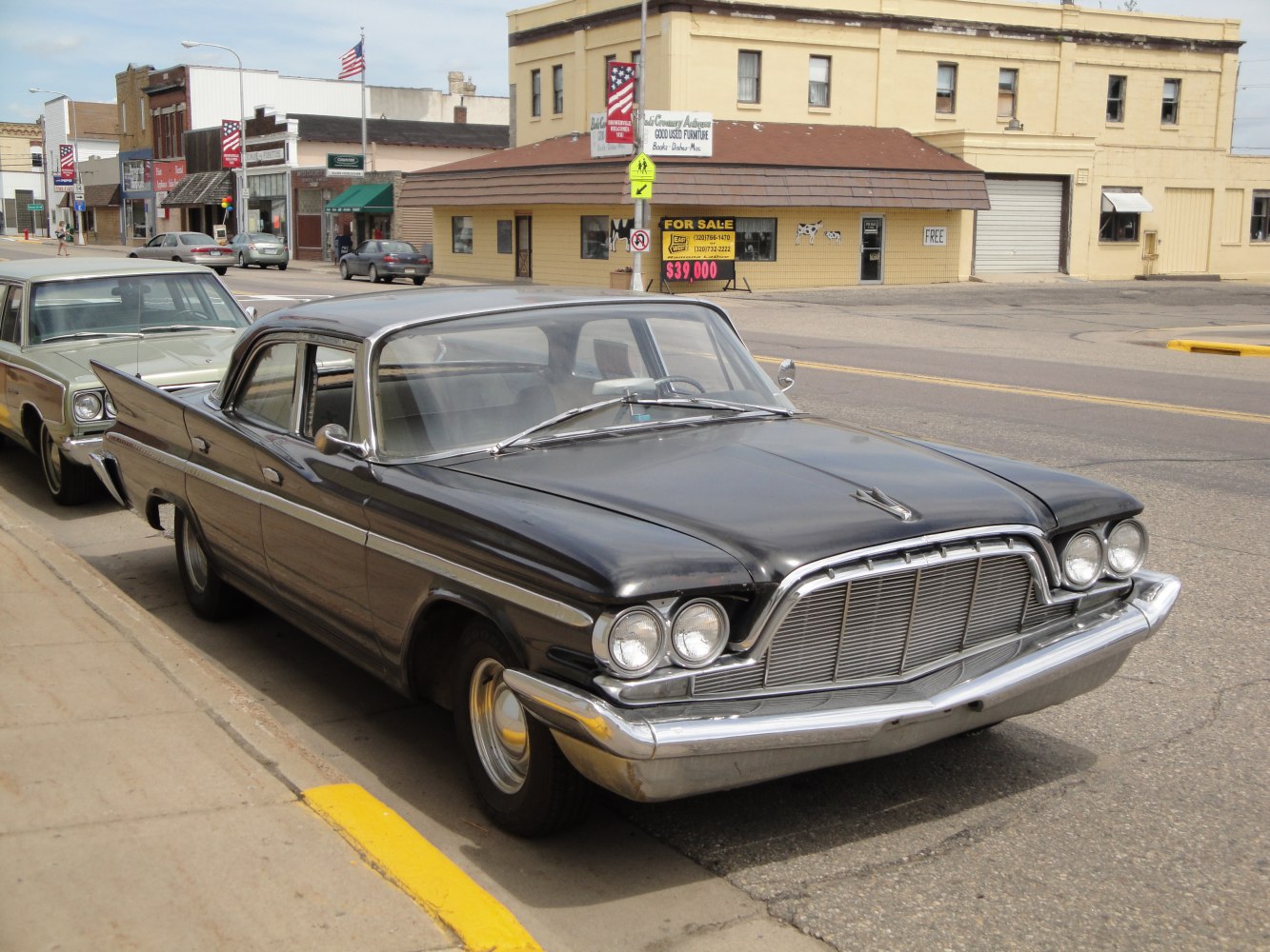 Front grille and rear tail fins of a classic 1960 sedan