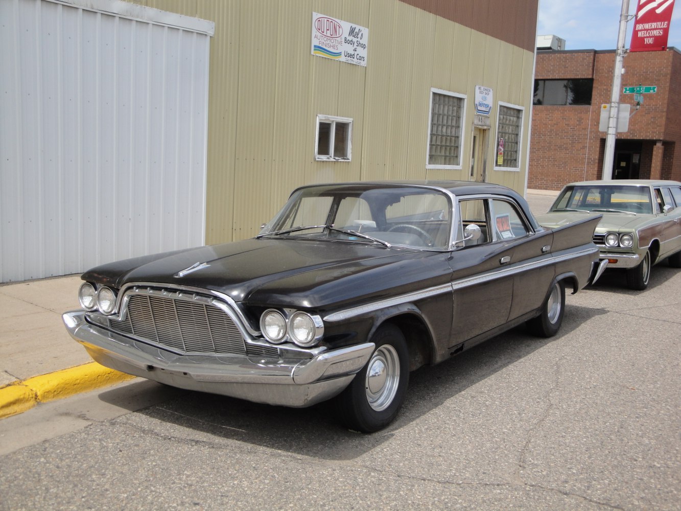 Classic four-door sedan with prominent front grille and dual round headlights