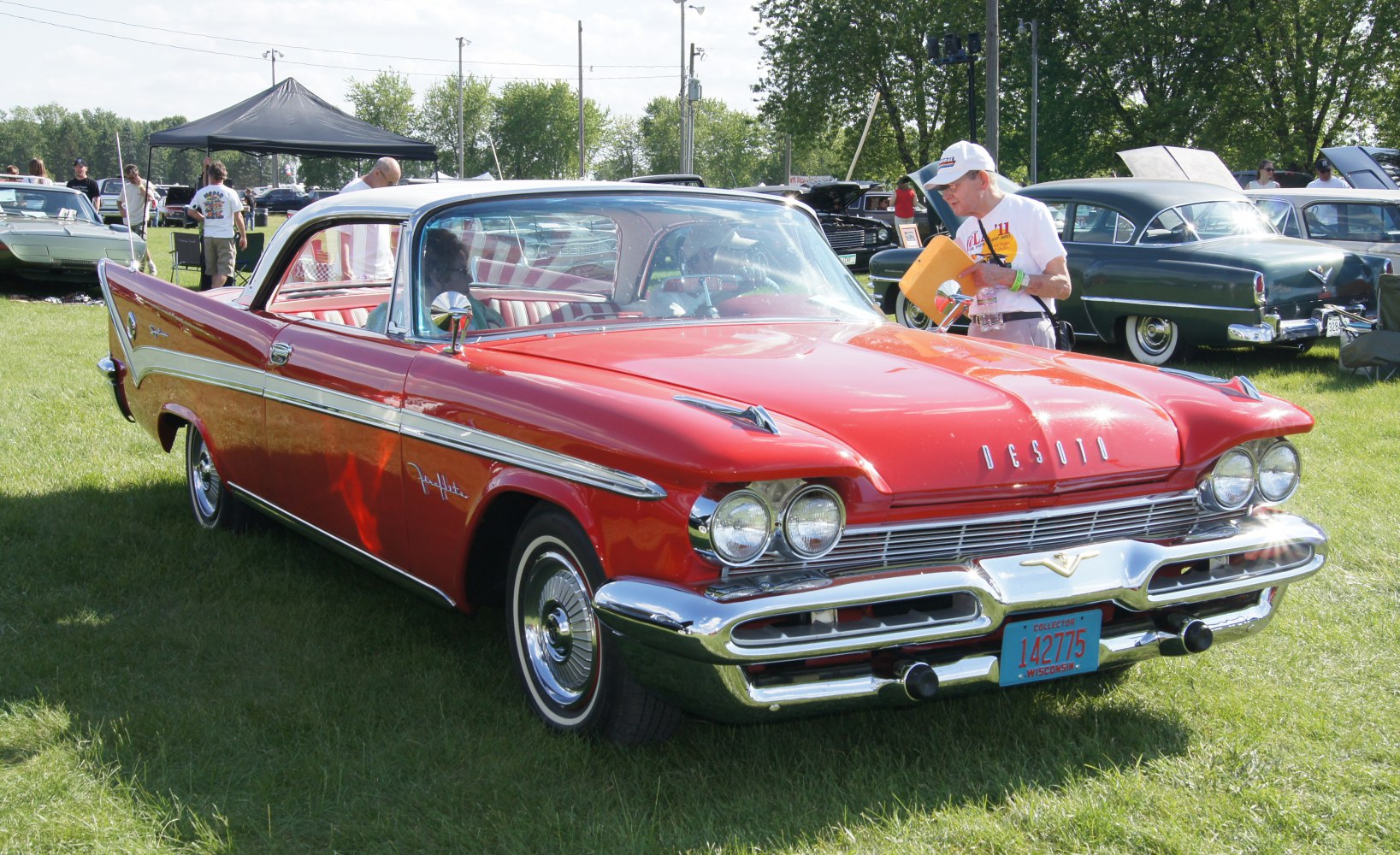 Two-door coupe with dual round headlights and chrome bumper