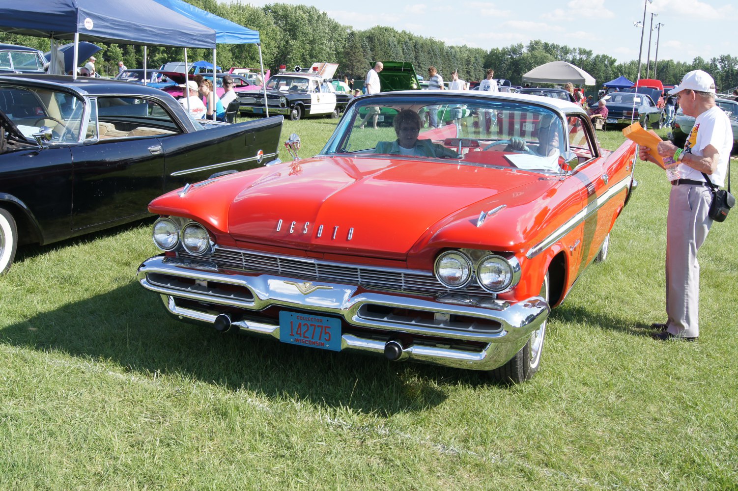 Front view of vintage two-door coupe with chrome grille and dual round headlights