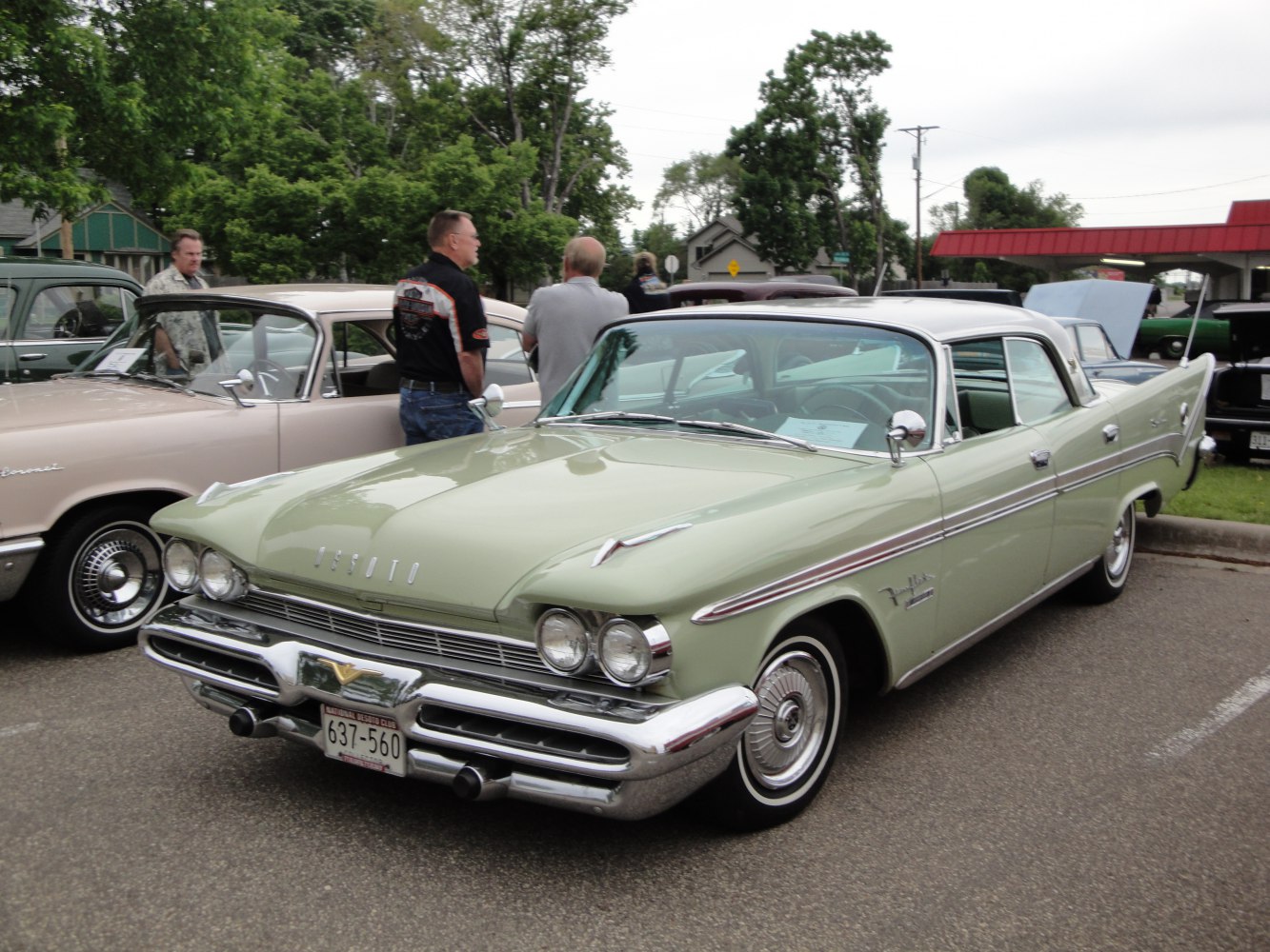 Classic vintage sedan with quad headlights and detailed chrome bumper.