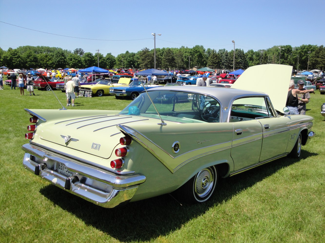 Classic sedan with large tailfins and tri-cluster rear tail lights