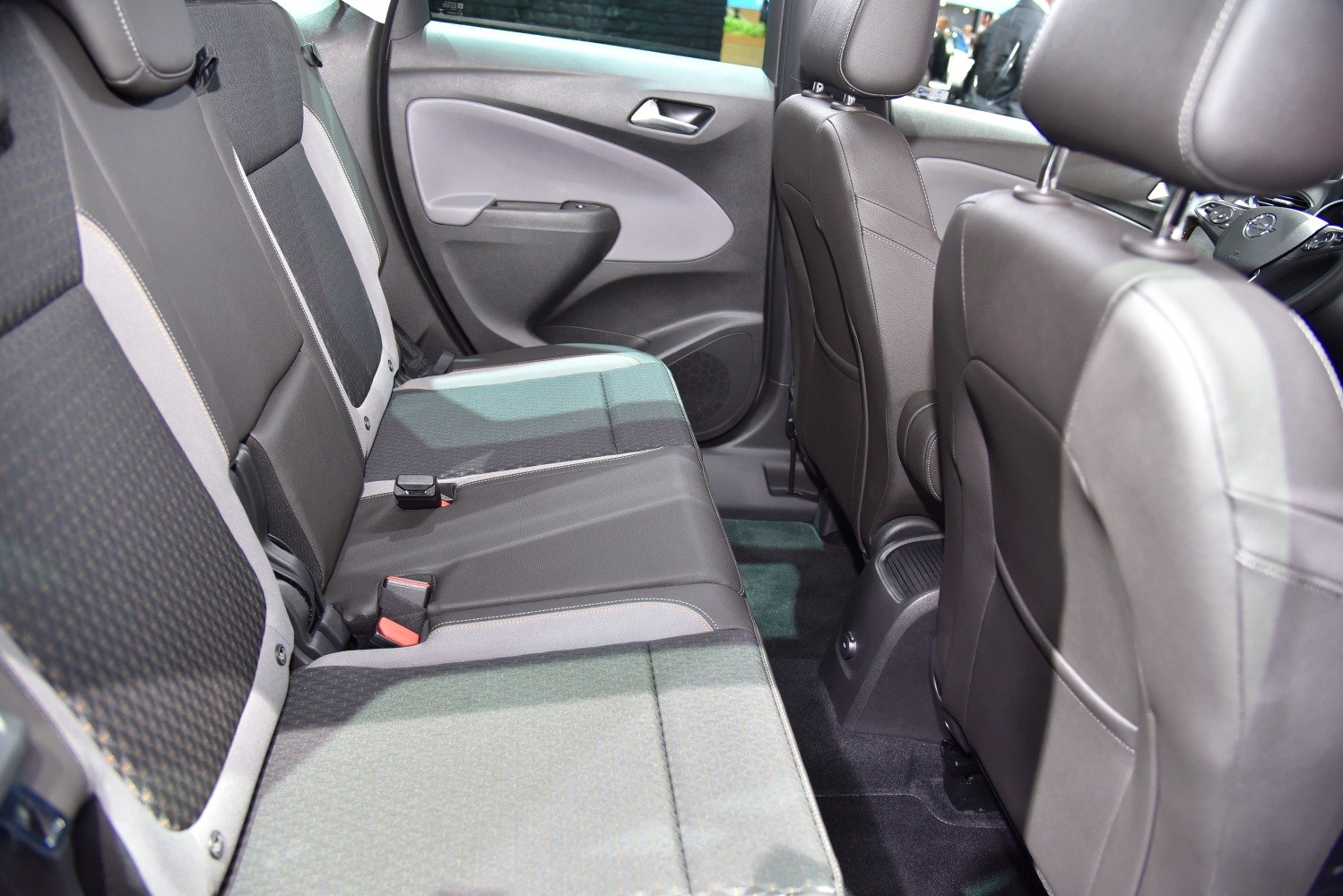 Rear passenger seats with fabric upholstery and spacious legroom