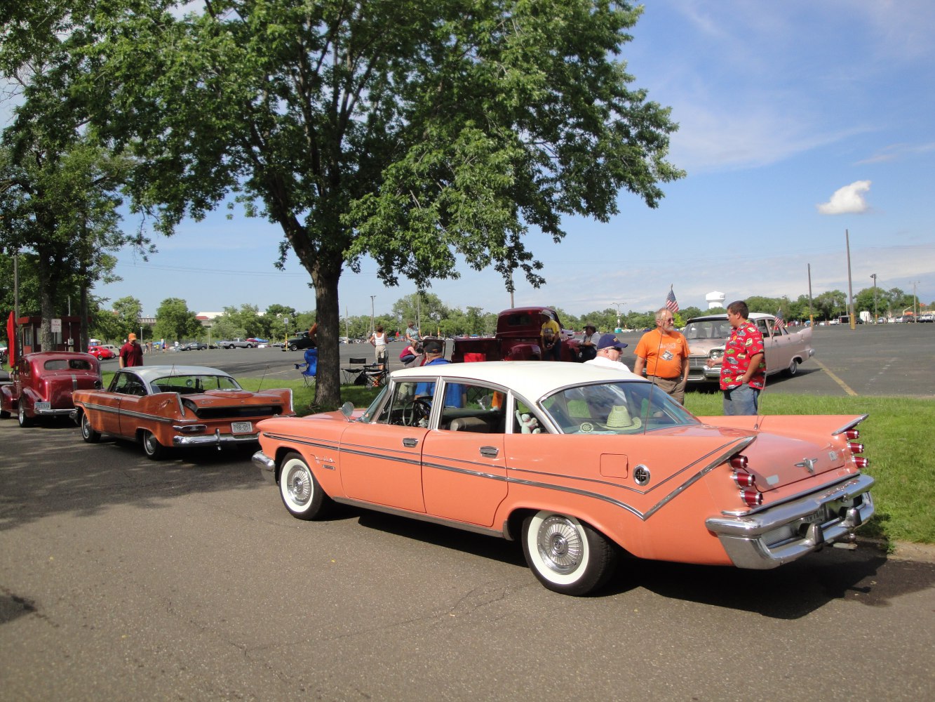 Vintage 1950s sedan with prominent tail fins and chrome trim