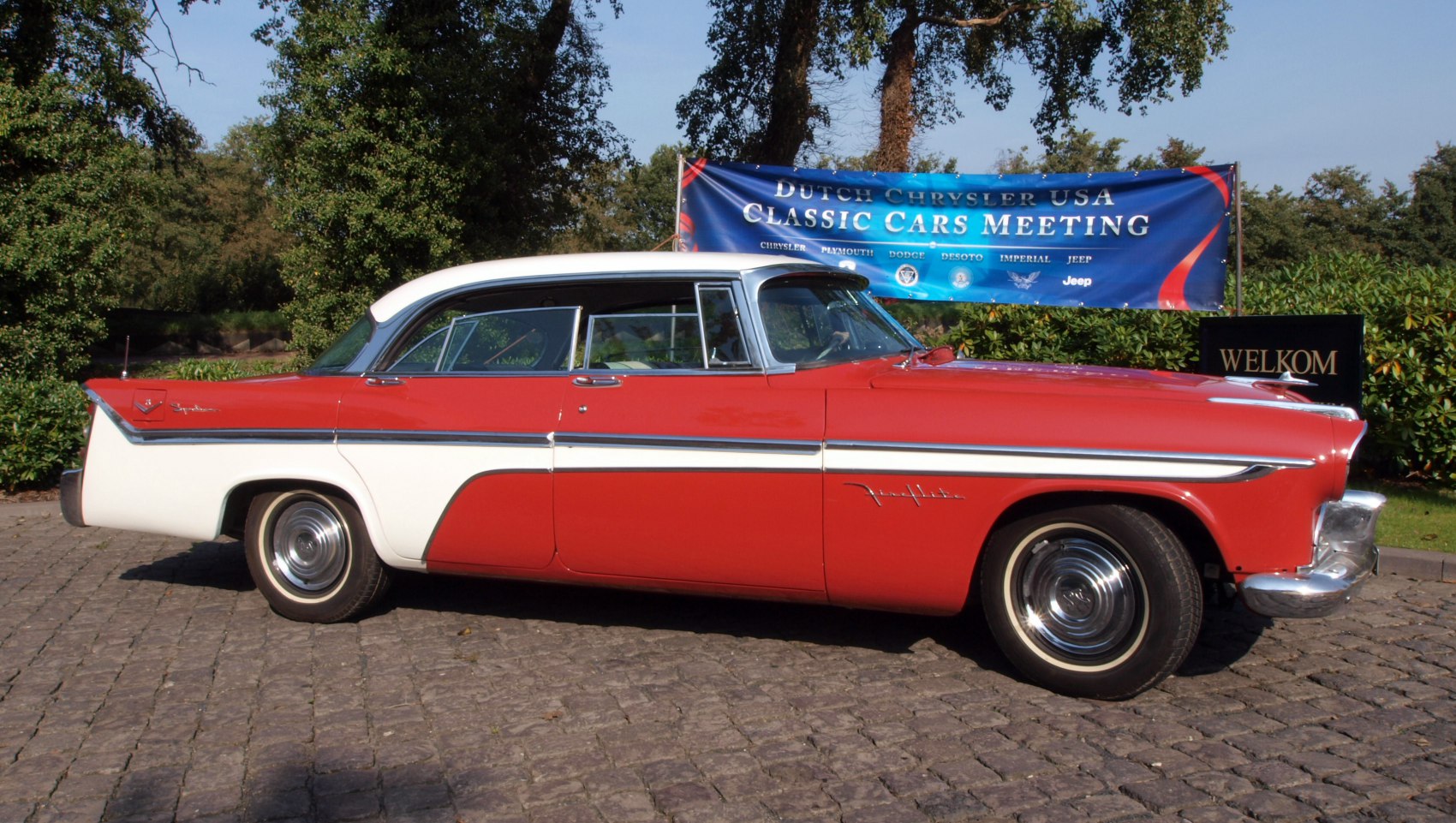 Vintage sedan with two-tone paint and prominent tail fins