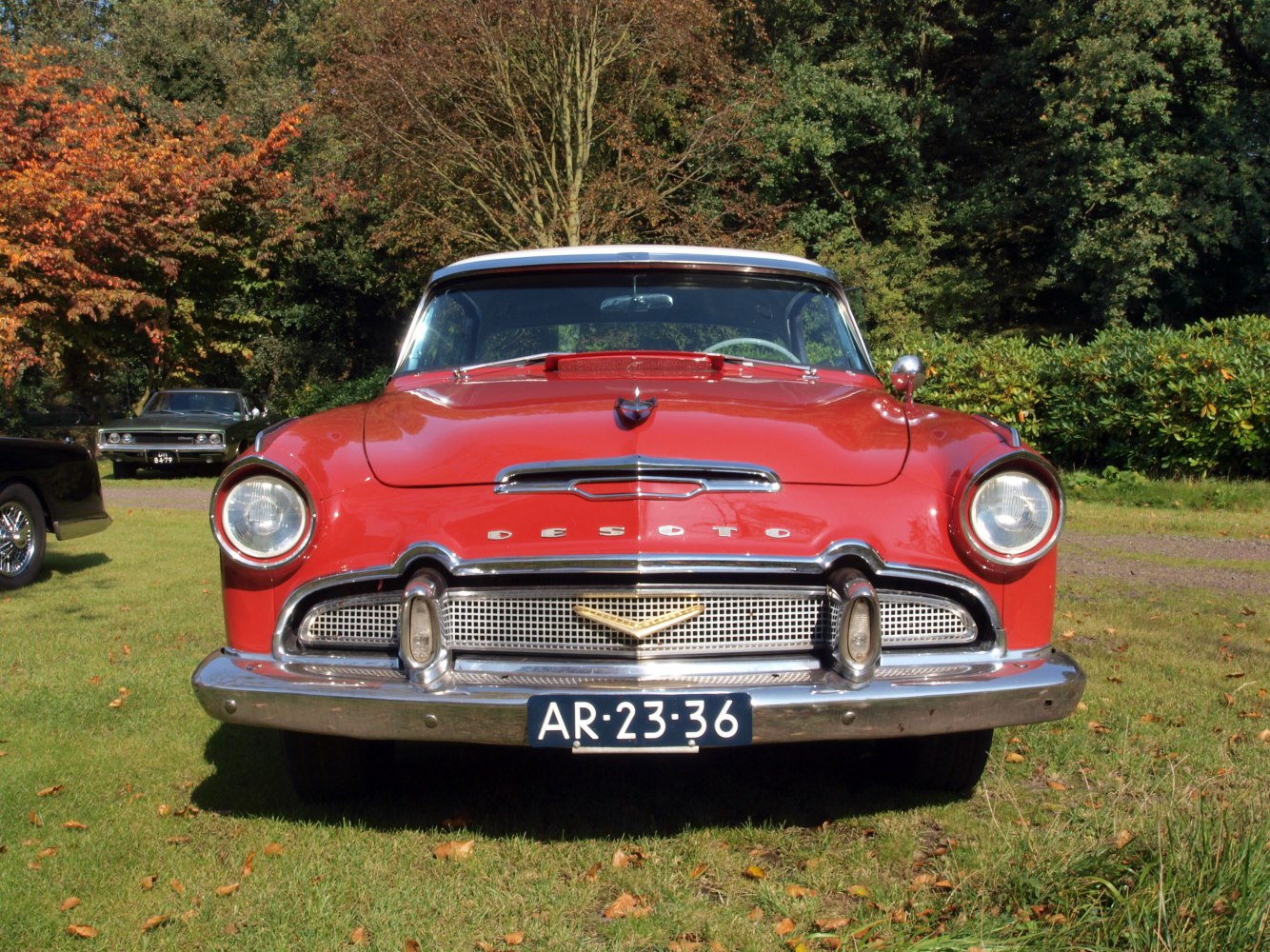 Front view of vintage 1950s sedan with round headlights and chrome grille
