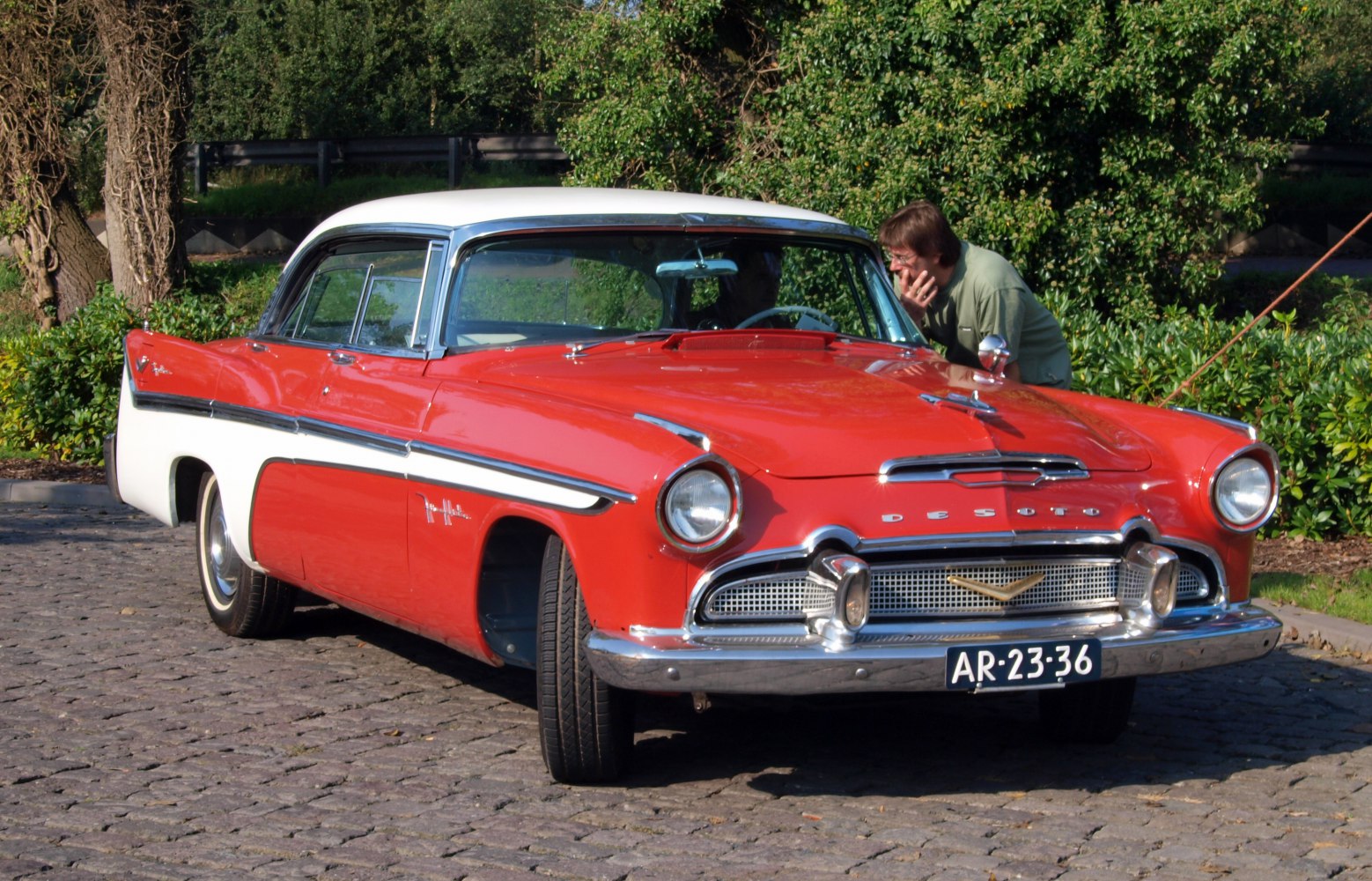 Front view of vintage 1950s classic car with chrome grille and dual-tone paint.