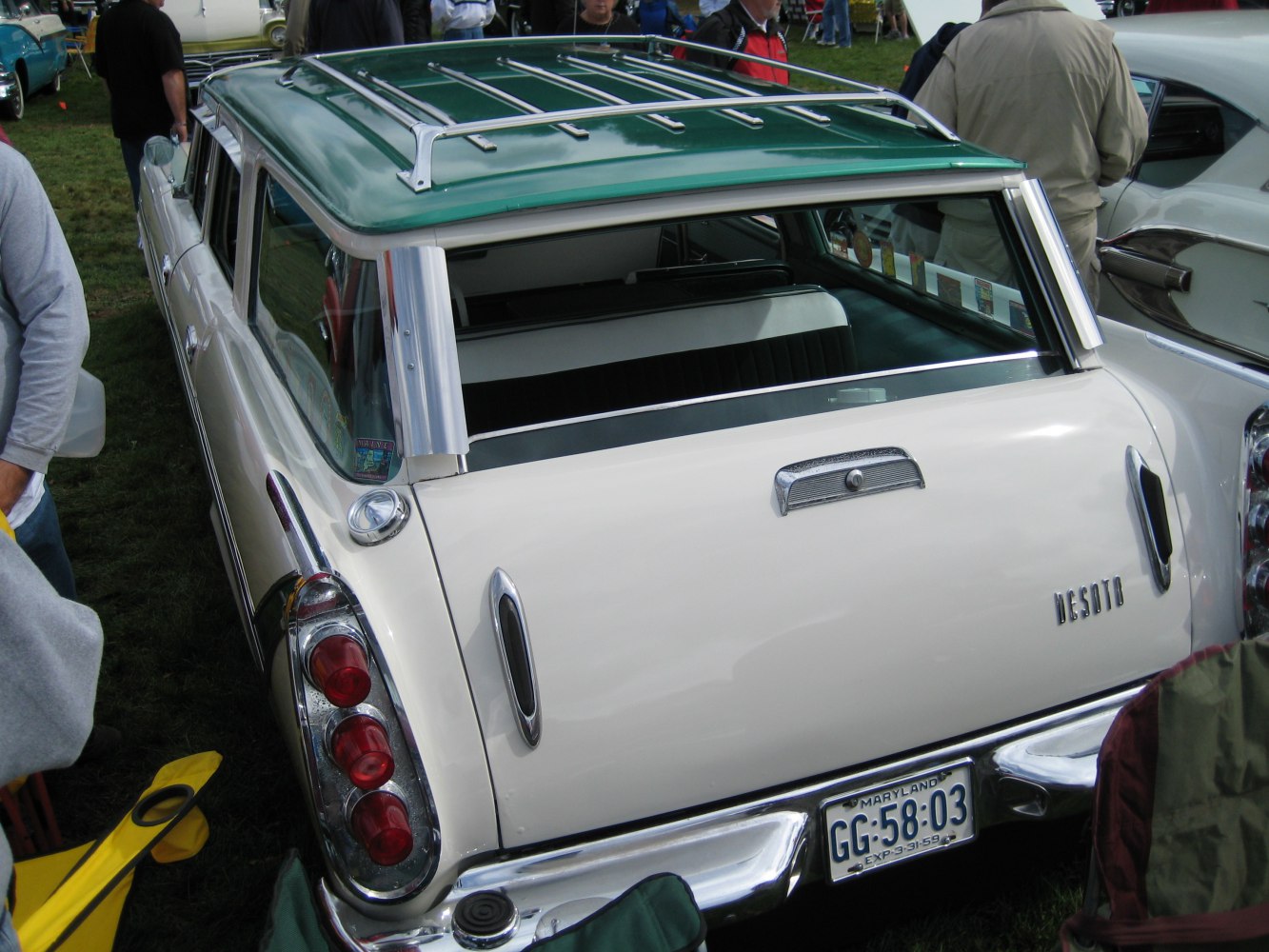 Vintage station wagon rear with vertical tail lights and roof rack