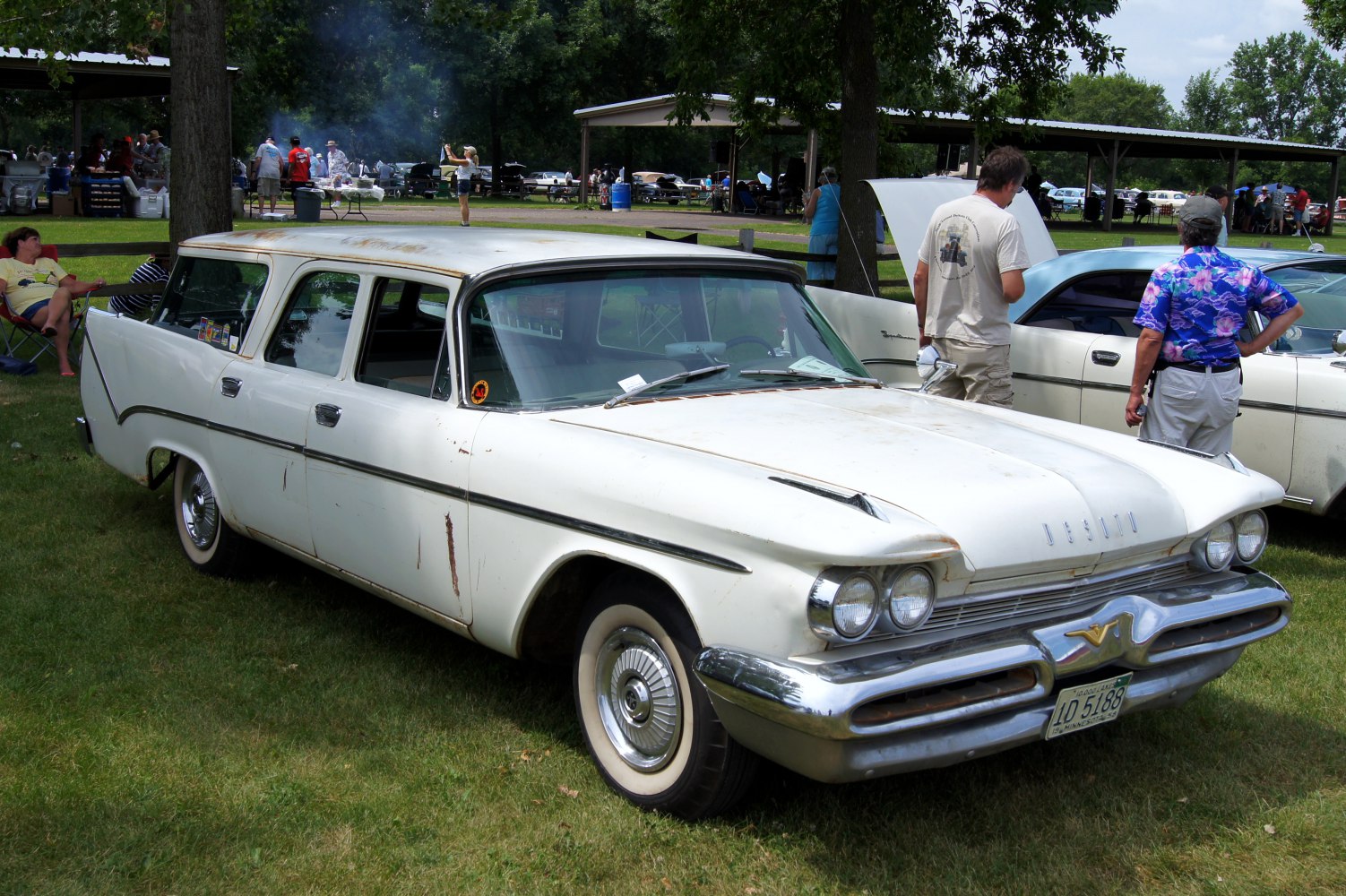 Classic station wagon with dual headlights and vintage chrome bumper.