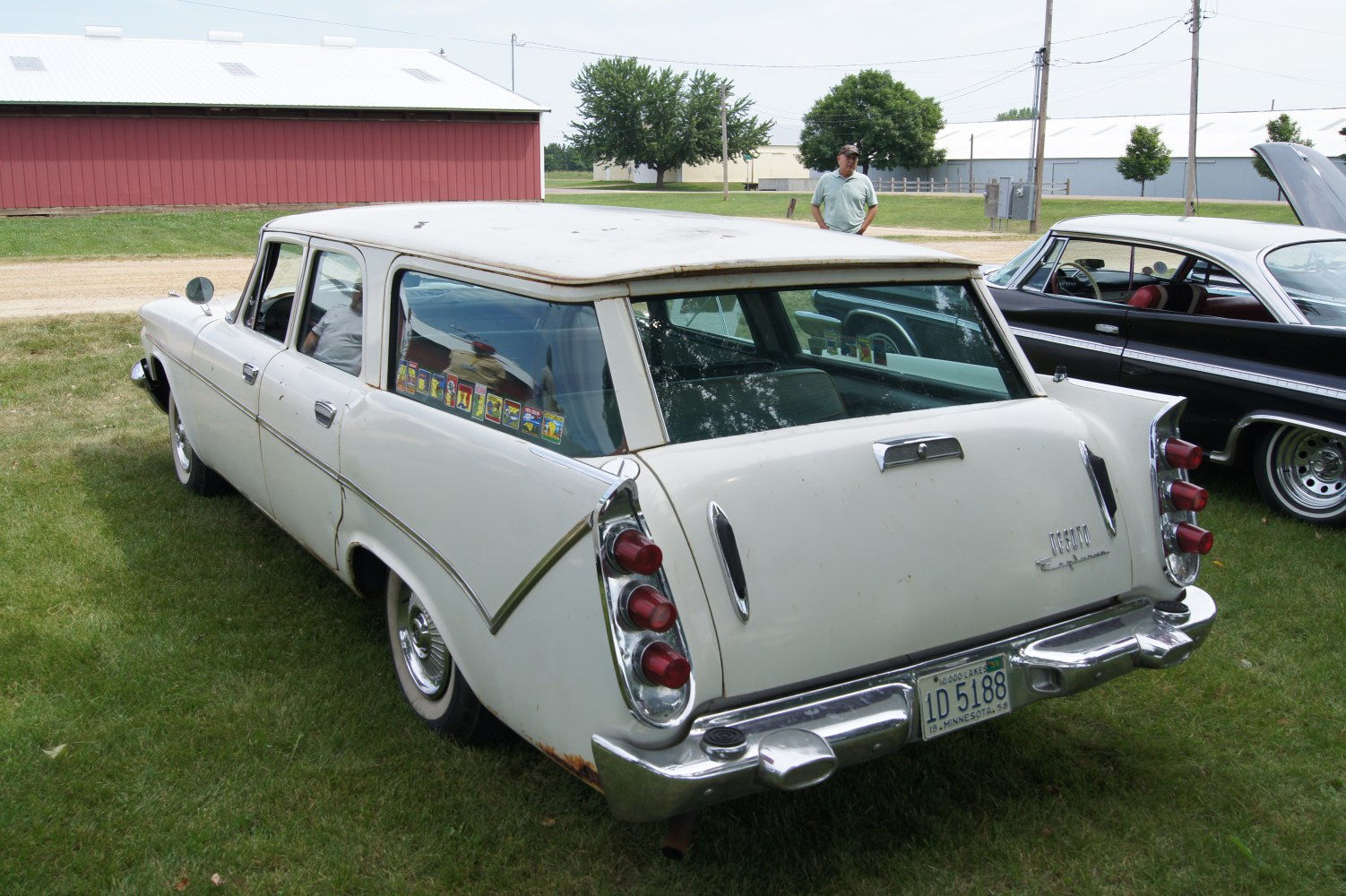 Classic 1959 station wagon rear with triple red tail lights and chrome accents