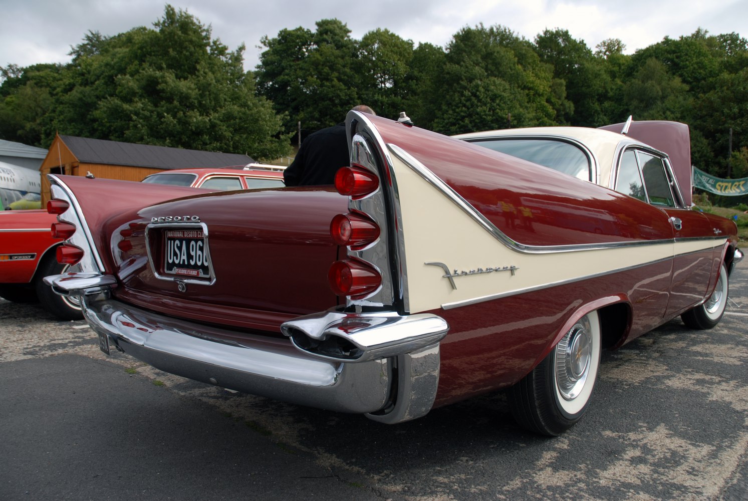 Classic 1950s tail fins and triple round taillights on chrome rear bumper.