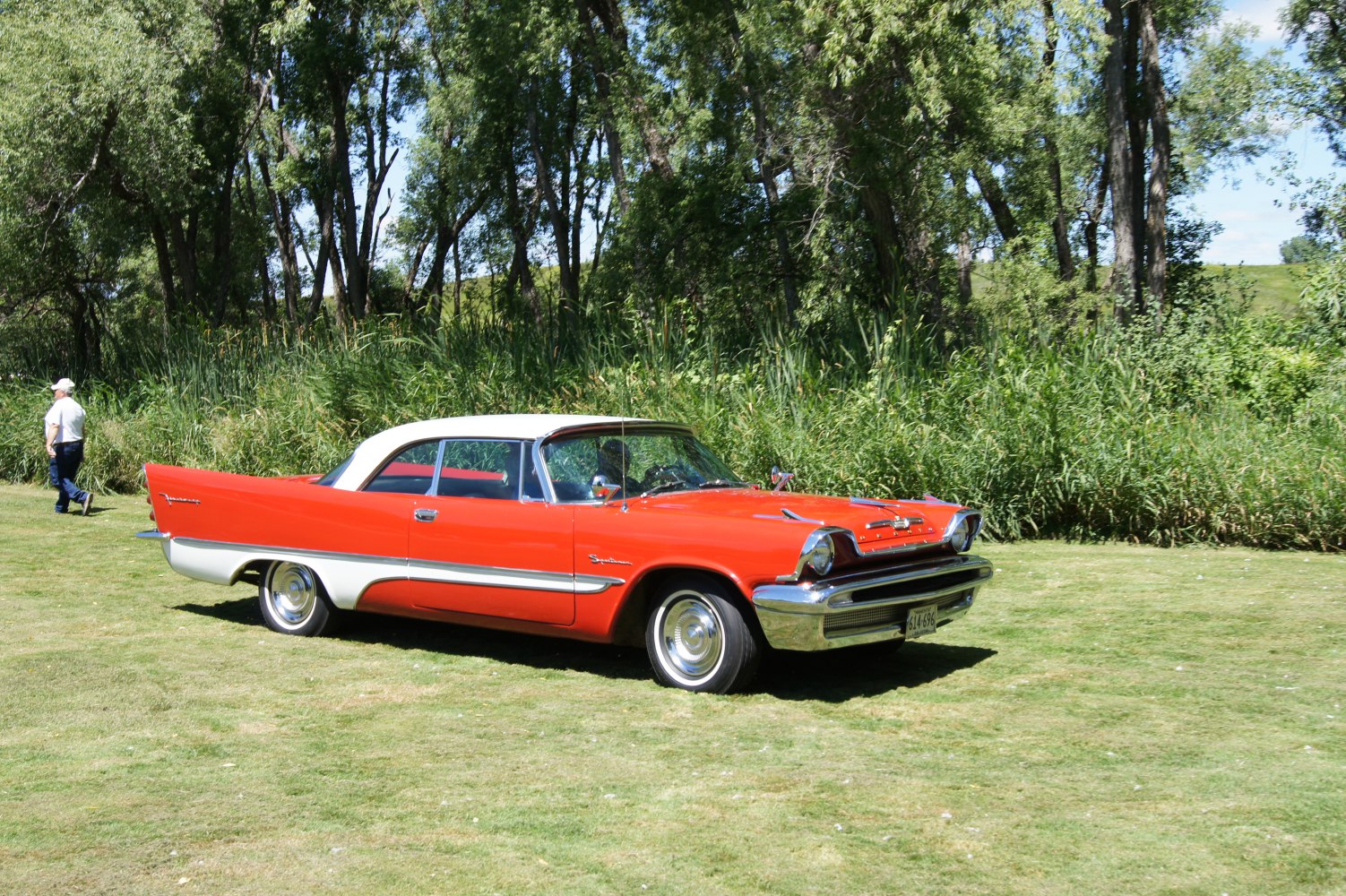 Two-tone coupe with distinctive tailfins and chrome details.