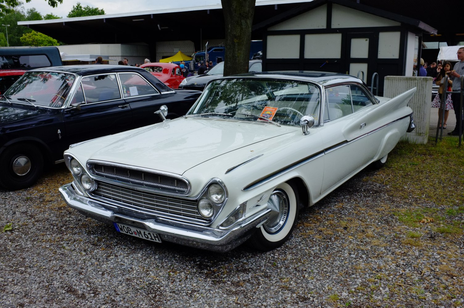 Vintage 2-door hardtop with prominent tail fins and dual front headlights