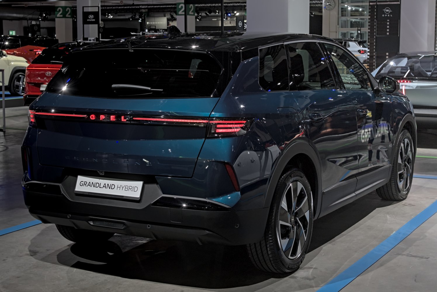 Rear view of a hybrid SUV with LED taillights and aerodynamic design