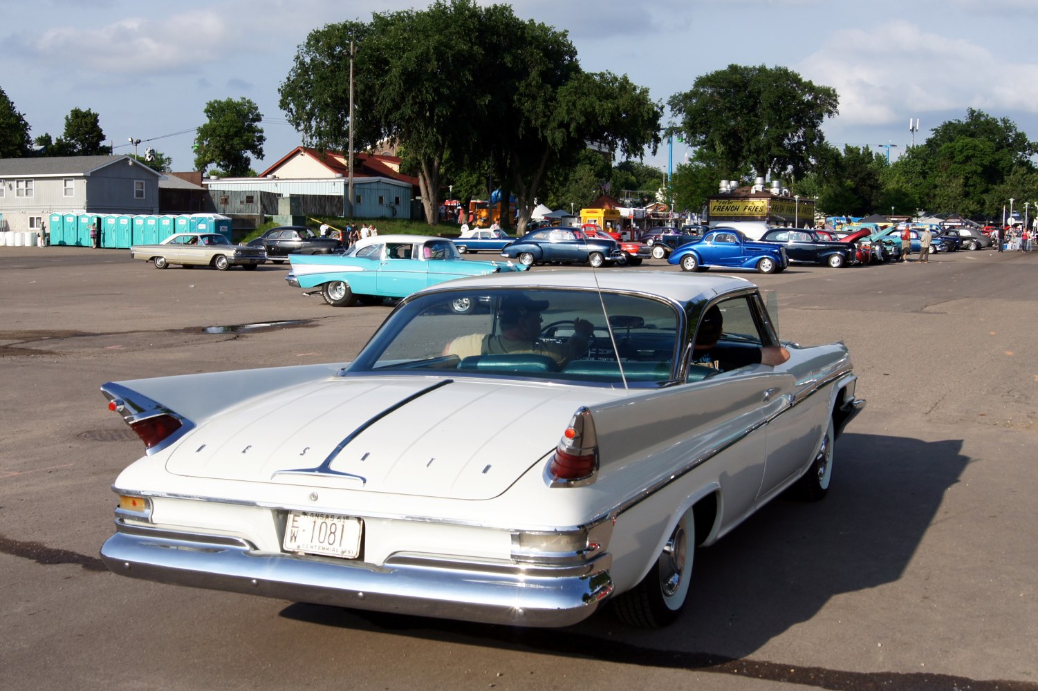 Rear view of finned tail lights and chrome bumper on a 2-door hardtop