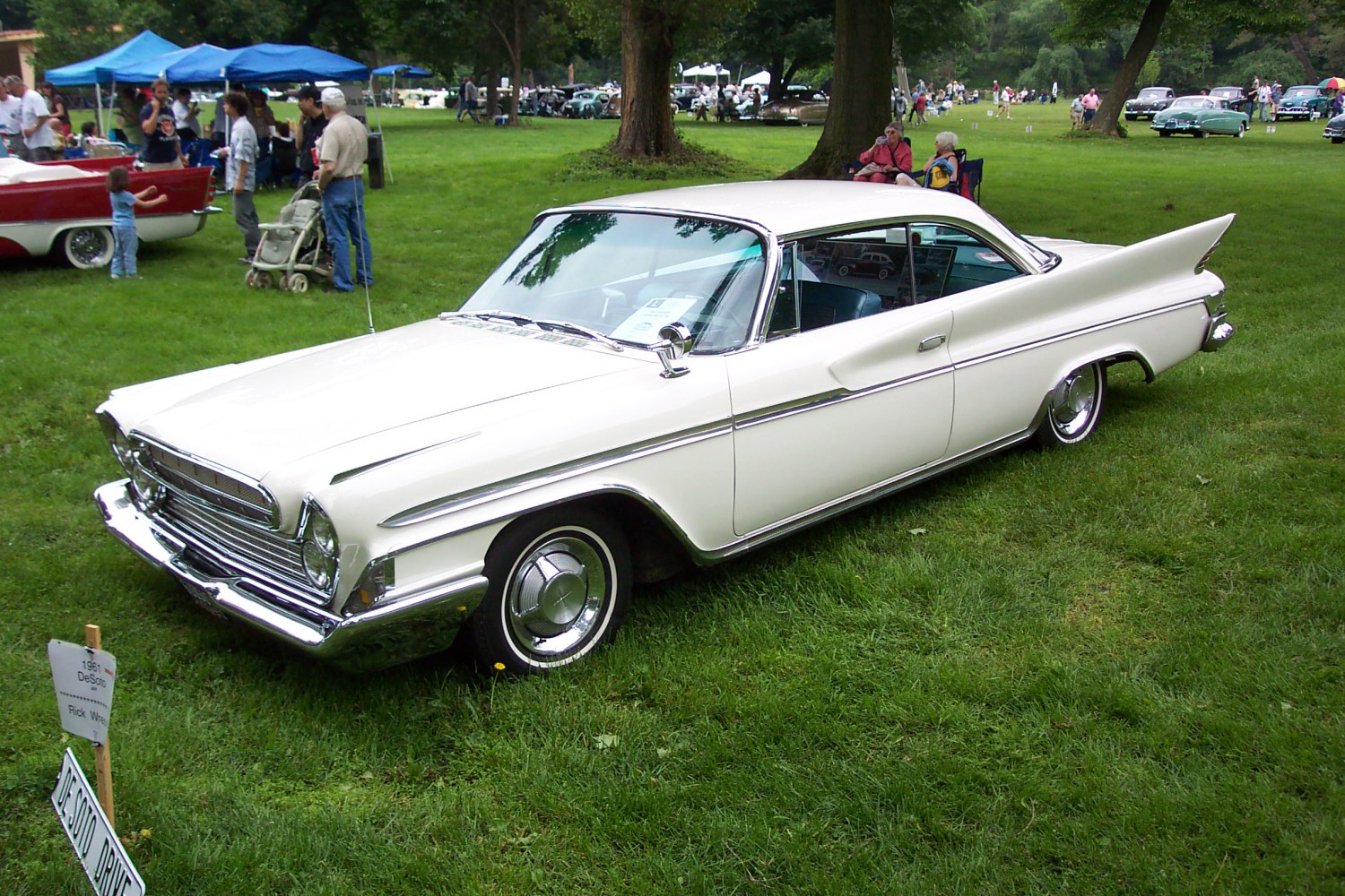 White 2-door hardtop with prominent tailfins and chrome details