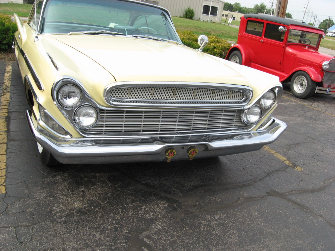 Close-up of front grill with quad headlights and chrome bumper