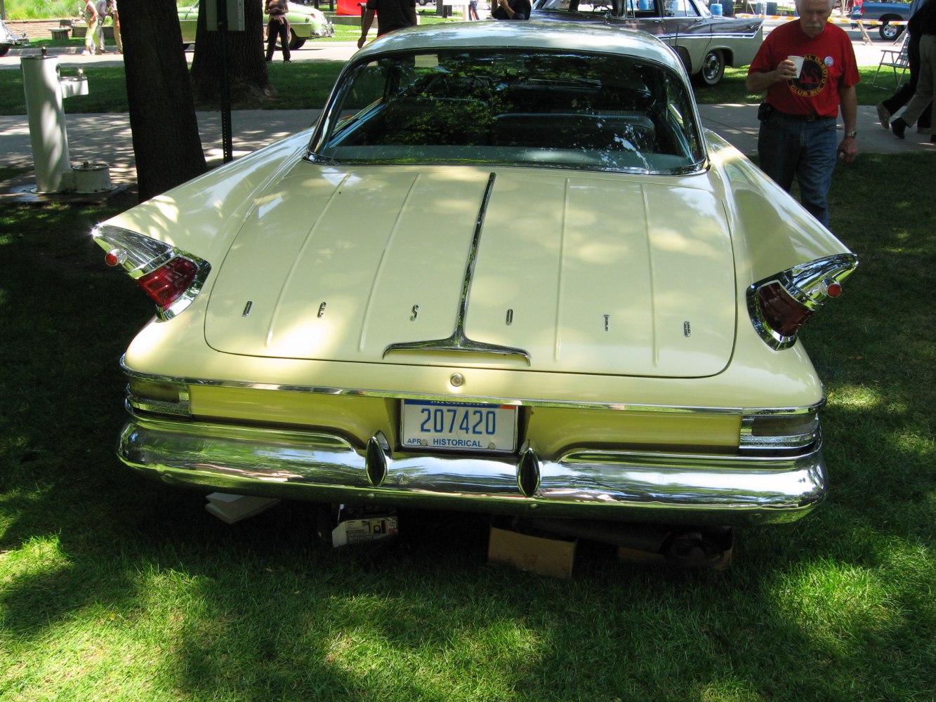 Rear view showing prominent tail fins and chrome bumper