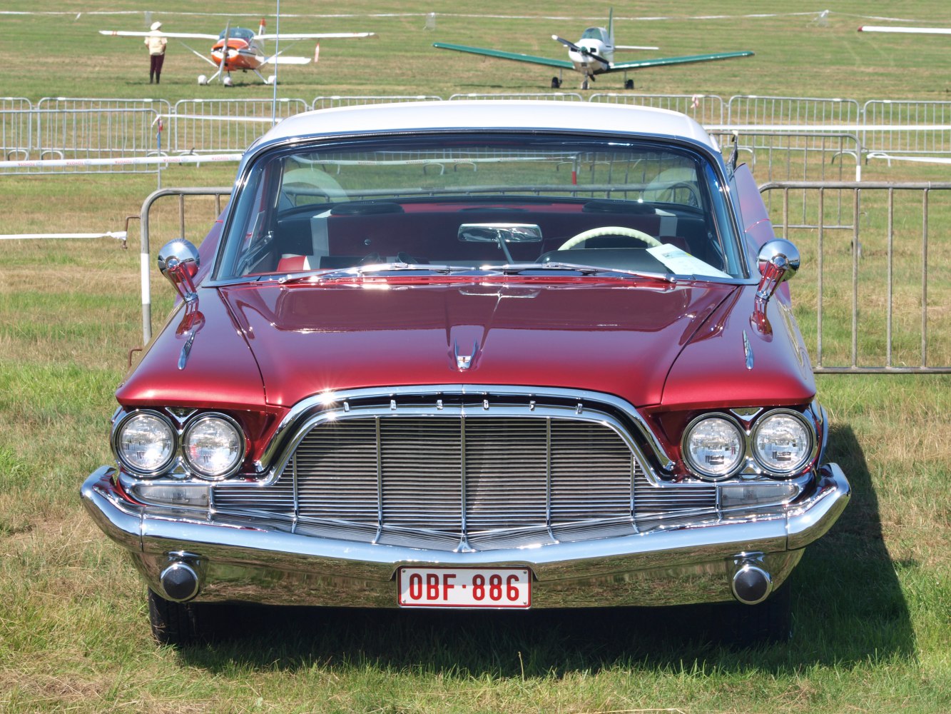 Classic 1960 car front with distinctive grille and quad headlights