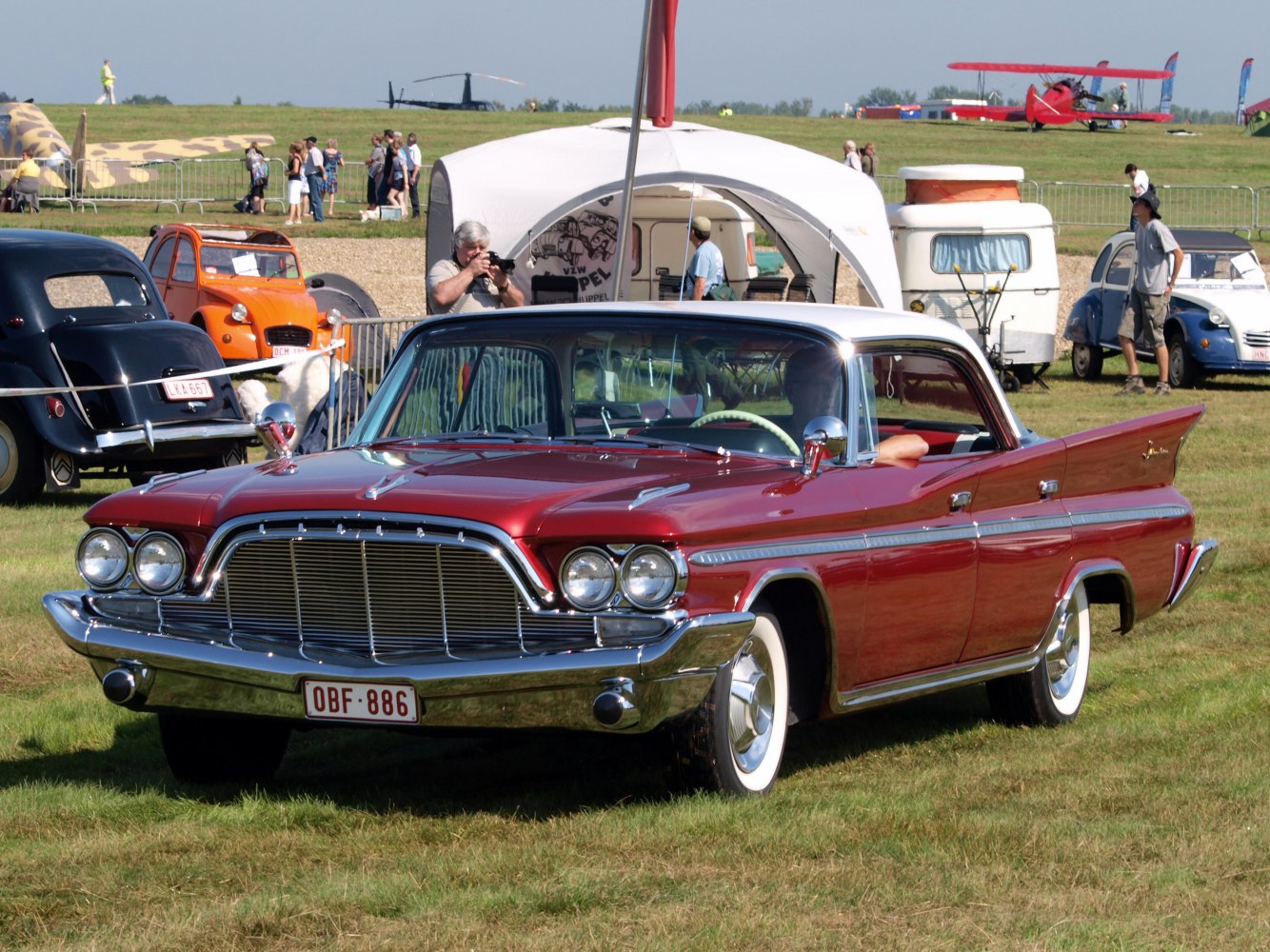 Classic 4-door hardtop car with prominent tail fins and dual round headlights
