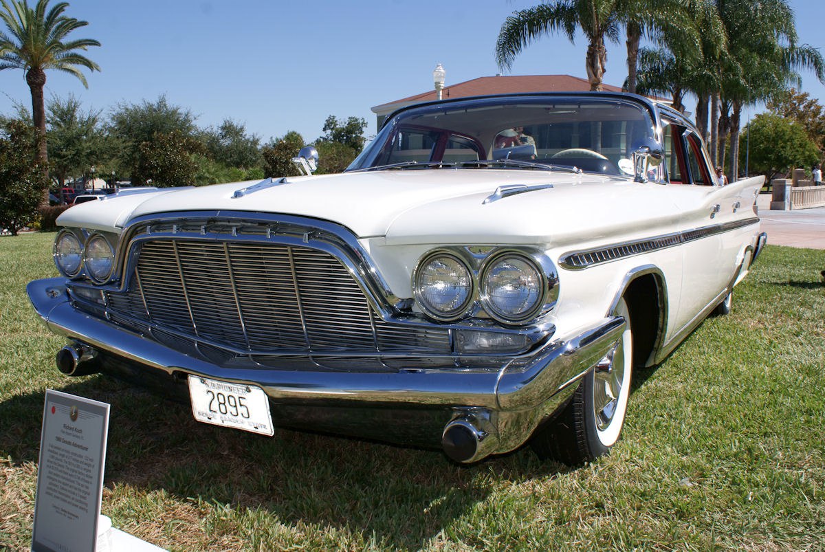 Large chrome grille and dual round headlights on a classic 4-door sedan