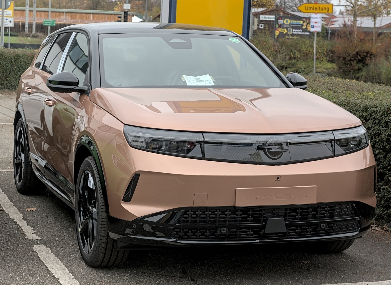 Front view highlighting LED headlights and black accented grille