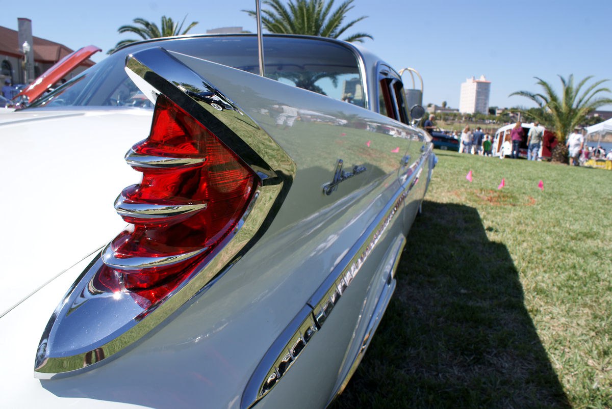 Distinctive tailfin with red chrome-trimmed taillight on vintage 1960s sedan