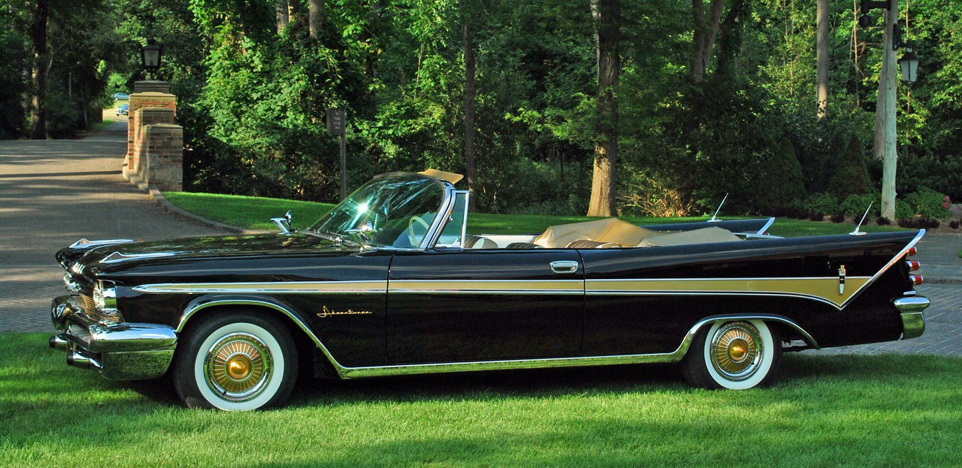 1959 convertible with pronounced tailfins and extensive chrome detailing