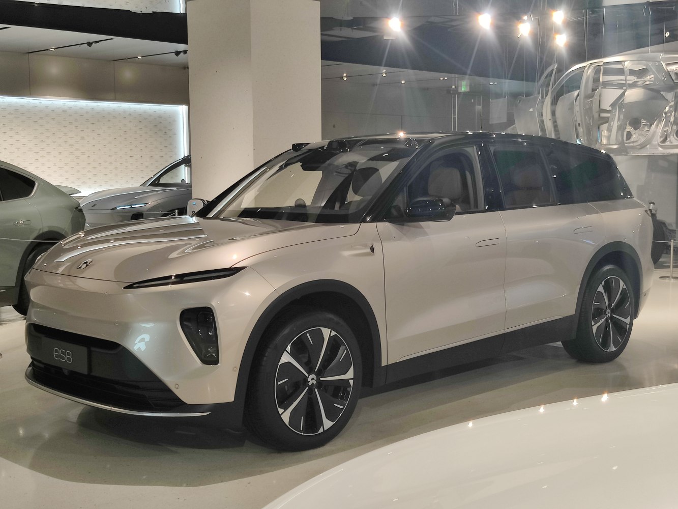 Front and side profile of modern electric SUV with sleek LED headlights and sporty alloy wheels