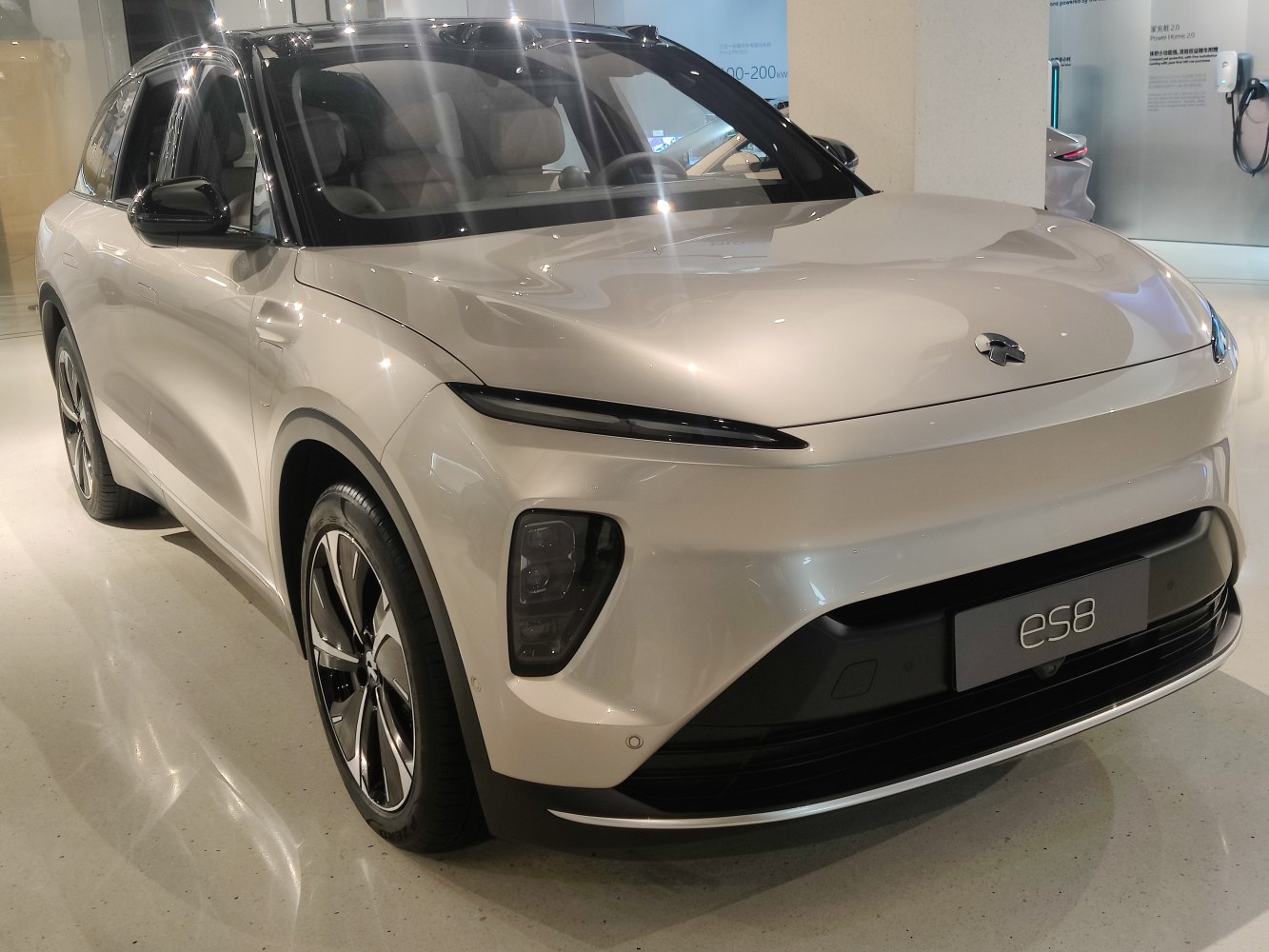 Front view of electric SUV with sleek LED headlights and aerodynamic design