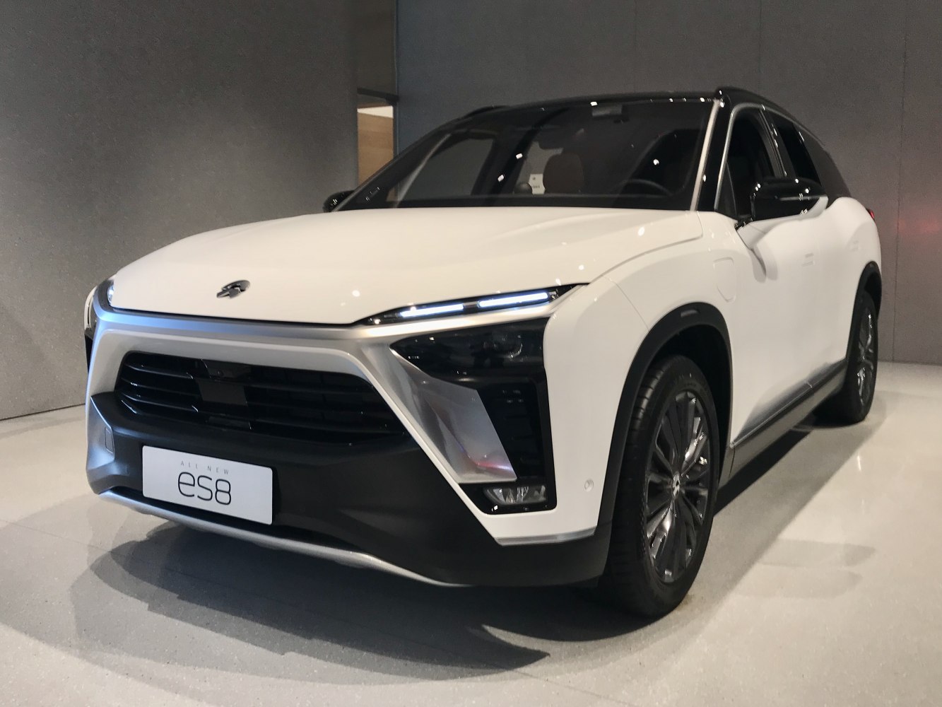 Front view with LED headlights and large grille
