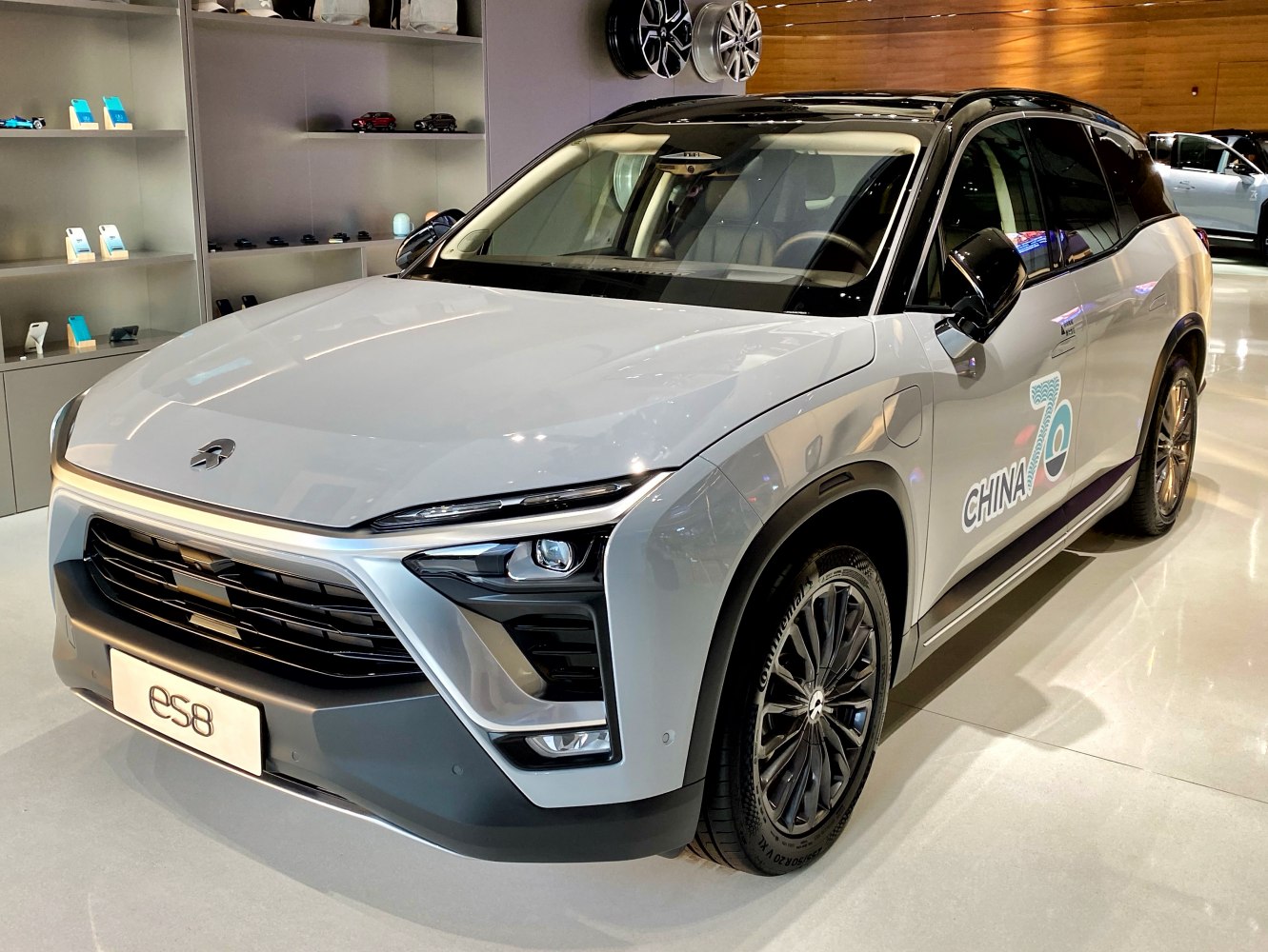 Front angle view with LED headlights and black alloy wheels