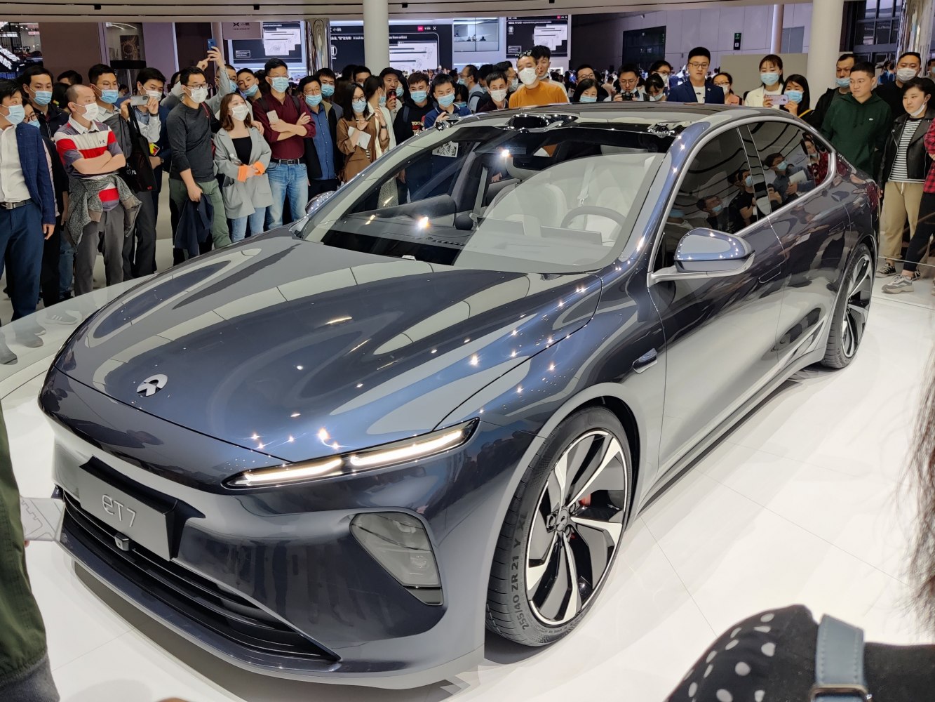 Sleek electric luxury sedan with aerodynamic body and stylish front headlights