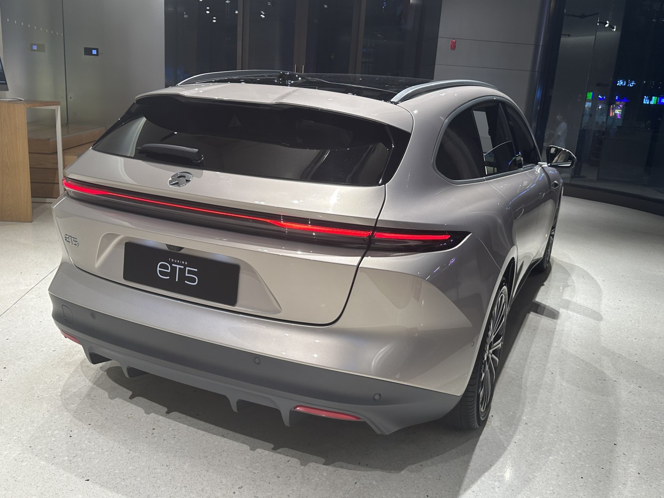 Rear view with continuous LED tail light and smooth hatchback design