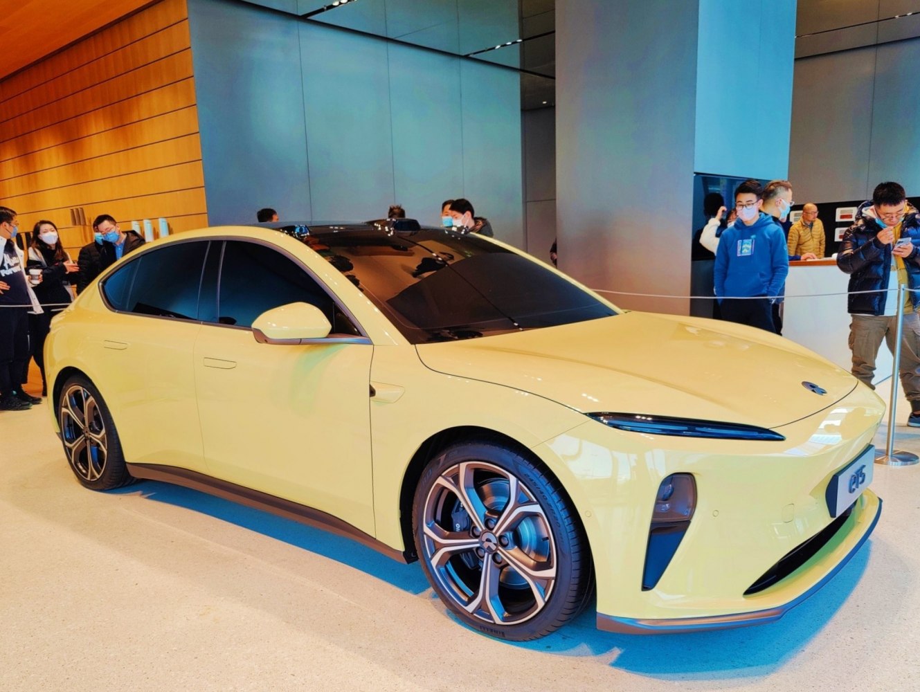 Sleek electric sedan with aerodynamic body and flush door handles