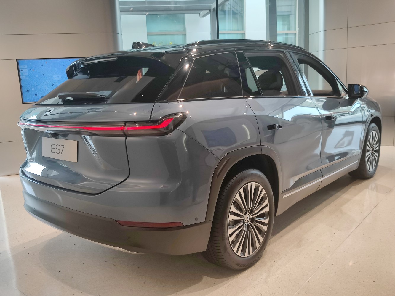 Rear of electric SUV with LED tail light strip and multi-spoke alloy wheels