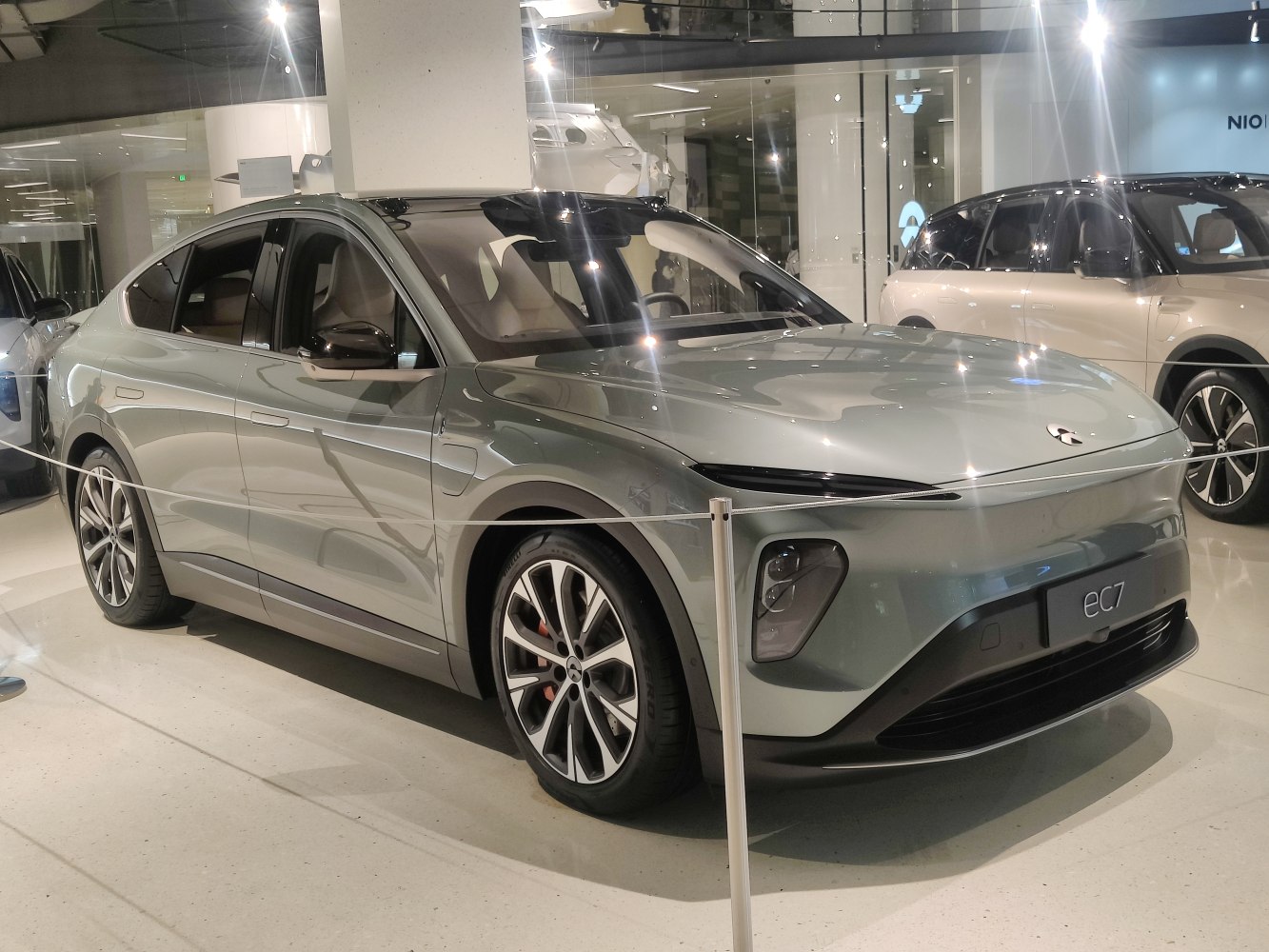 Sleek electric SUV with aerodynamic design and modern LED headlights.