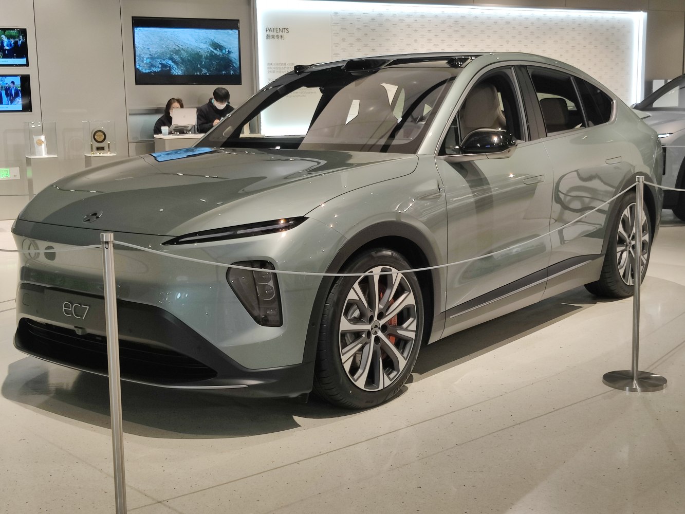 Sleek electric crossover with sharp LED headlights and alloy wheels