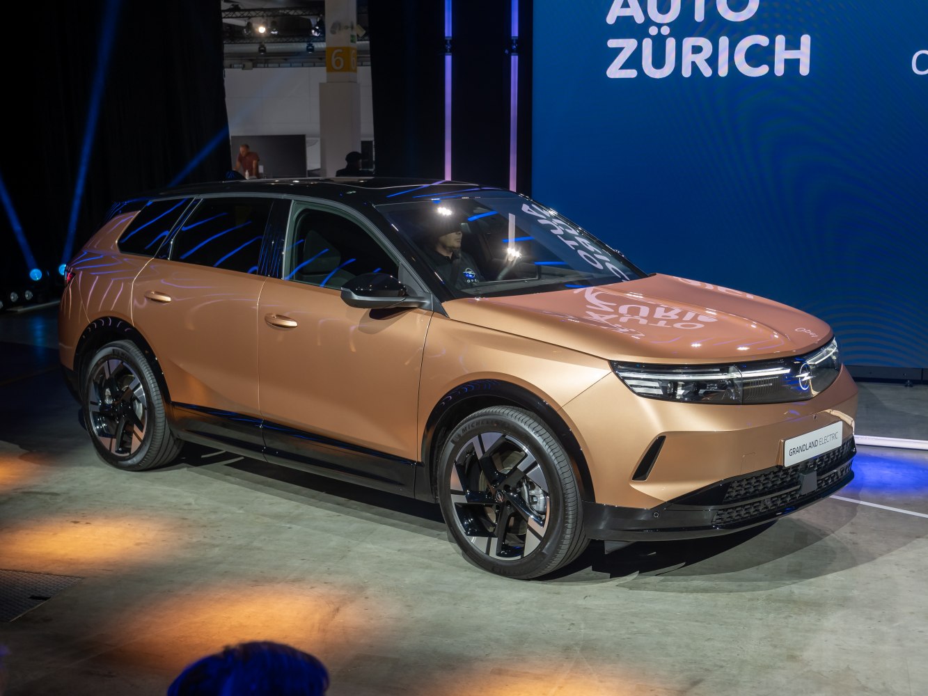 Electric SUV with sharp LED headlights and futuristic alloy wheels
