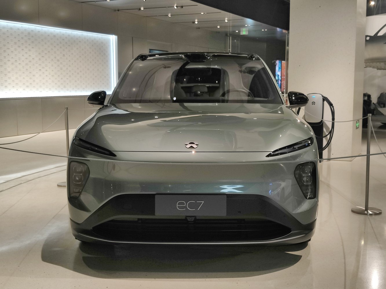 Sleek front view with slim LED headlights and aerodynamic hood.